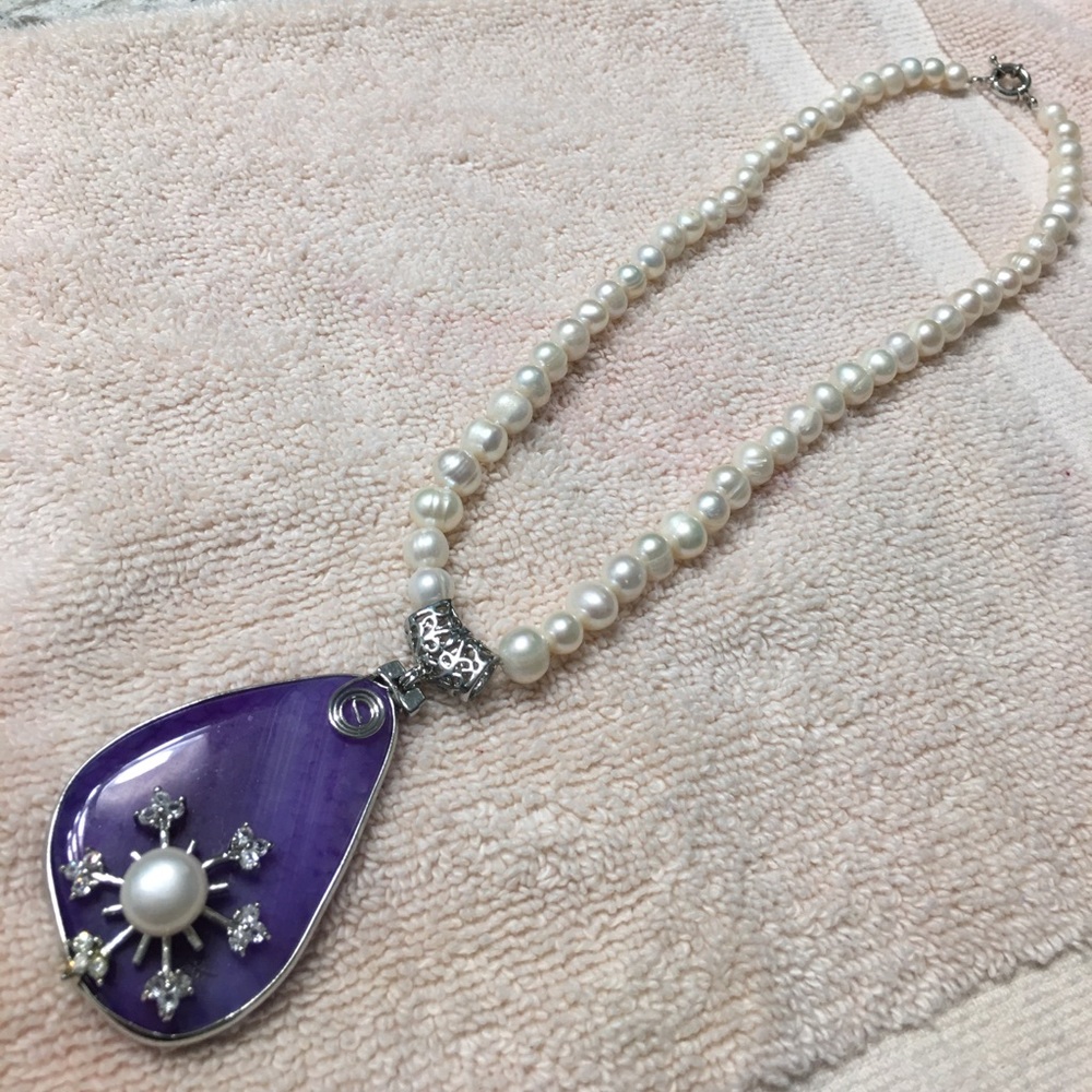 Pearl necklace with purple stone